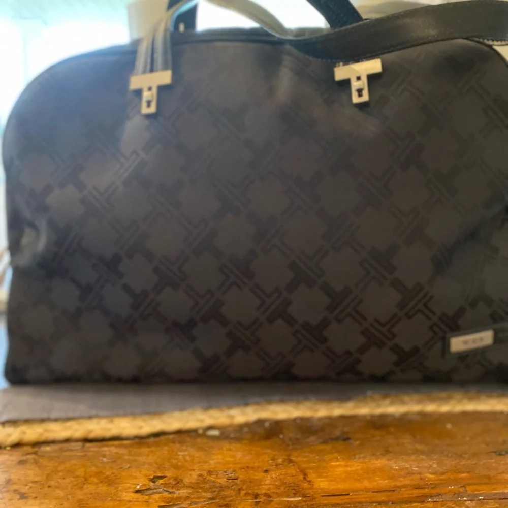 Tumi preowned definately